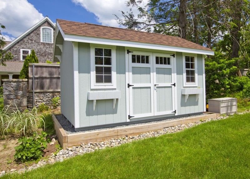 Modern garden shed painted grey with white highlights, twin windows 