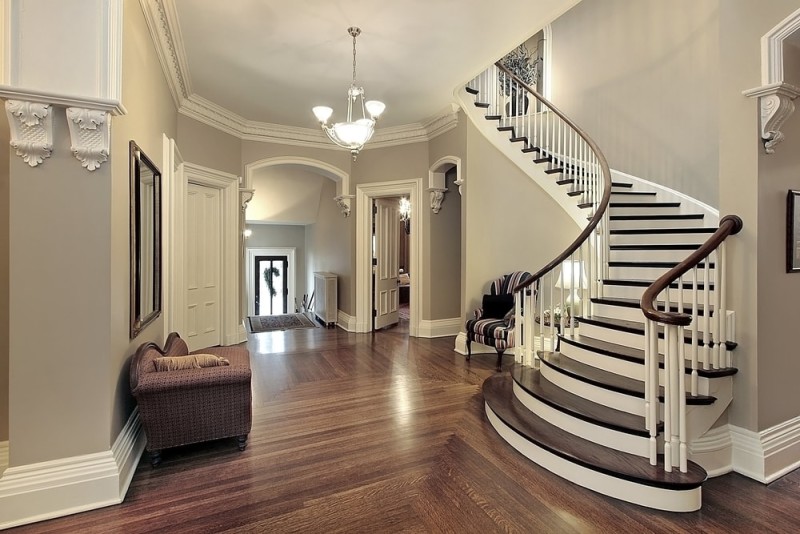 Foyer Interior Design at its best in this beautiful traditional home with rounded timber staircase