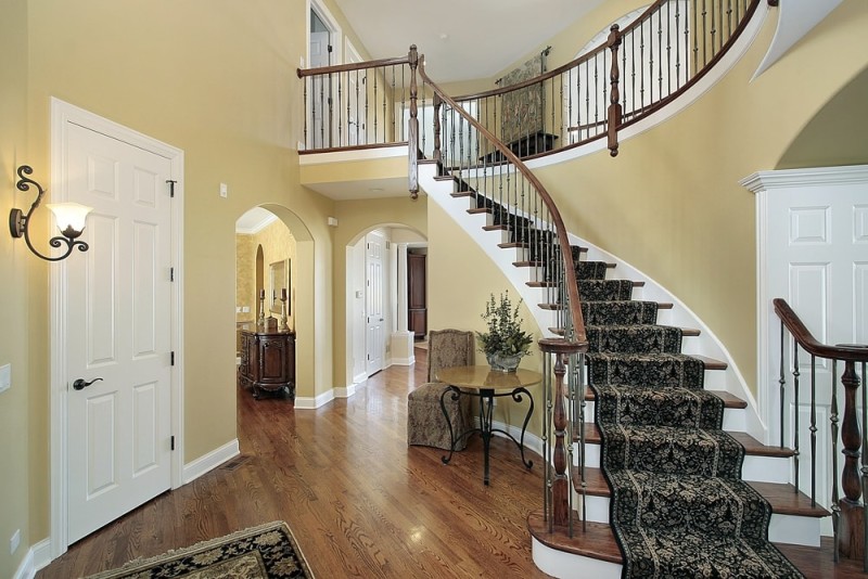 Staircase In Foyer That Separates Living Room